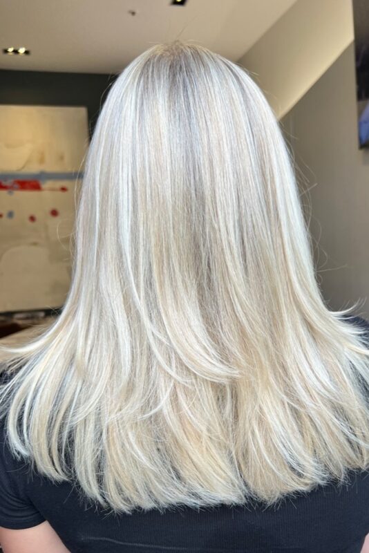 Woman with creamy blonde highlights.