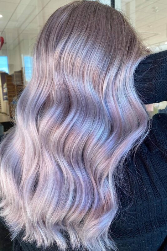 Woman with icy lavender pearl hair.