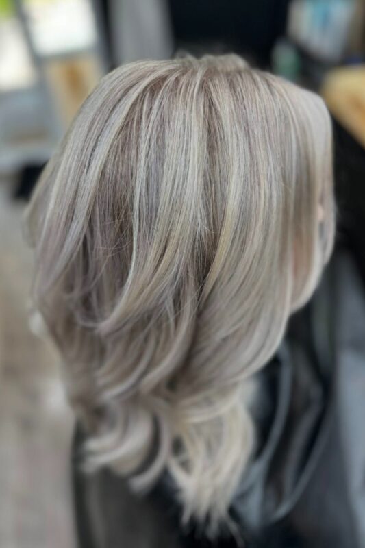 Woman with icy pearl blonde hair.