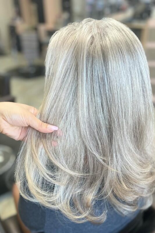 Woman with platinum ice blonde hair.