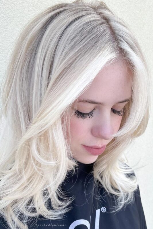 Woman with white sand hair color.