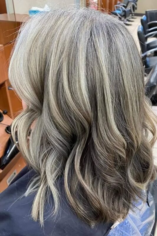 Blending gray around the face with white blonde highlights.