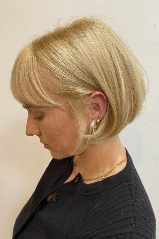 Woman with a blonde French bob.