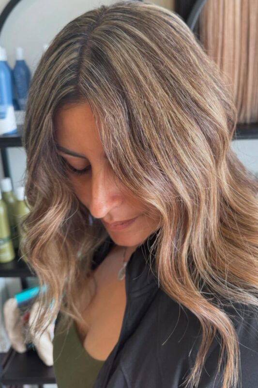 Dark hair with blonde highlights for blending gray.