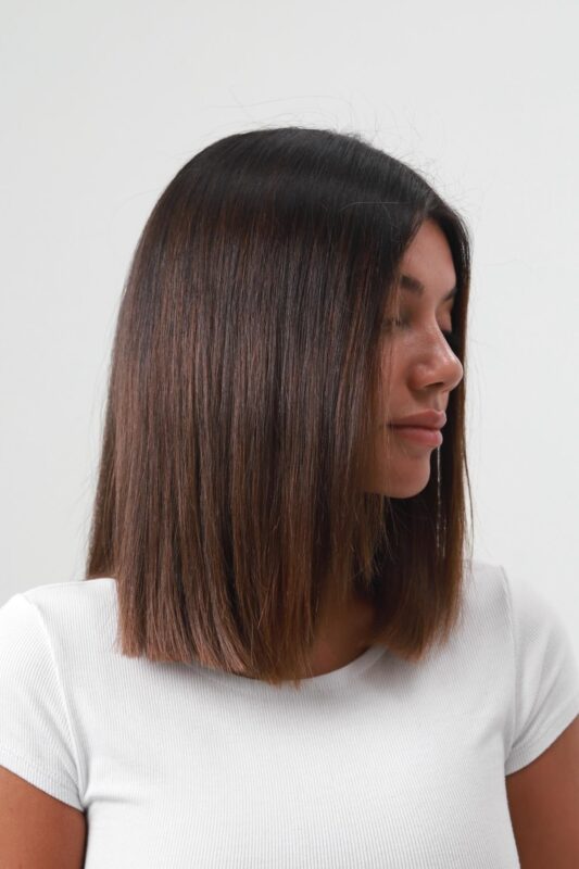 Woman with a blunt bob tailored for thin hair.