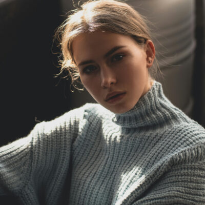 Woman with grey blended brunette hair.