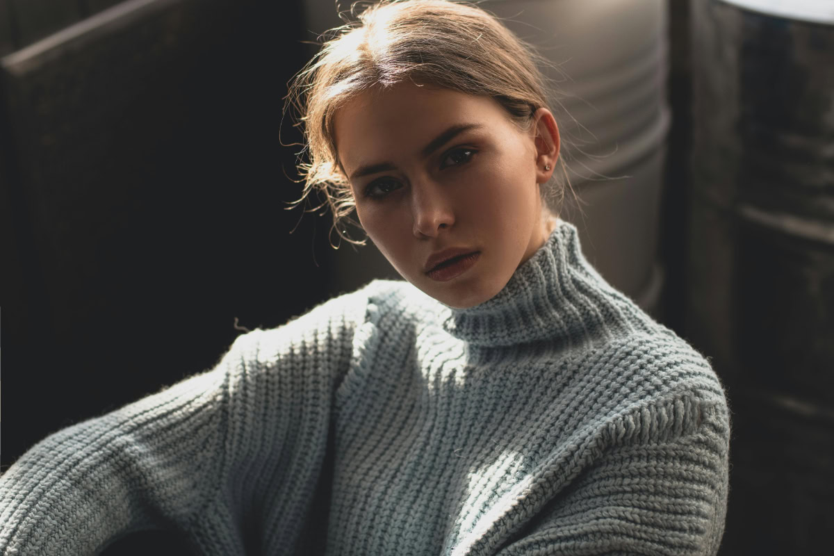 Woman with grey blended brunette hair.