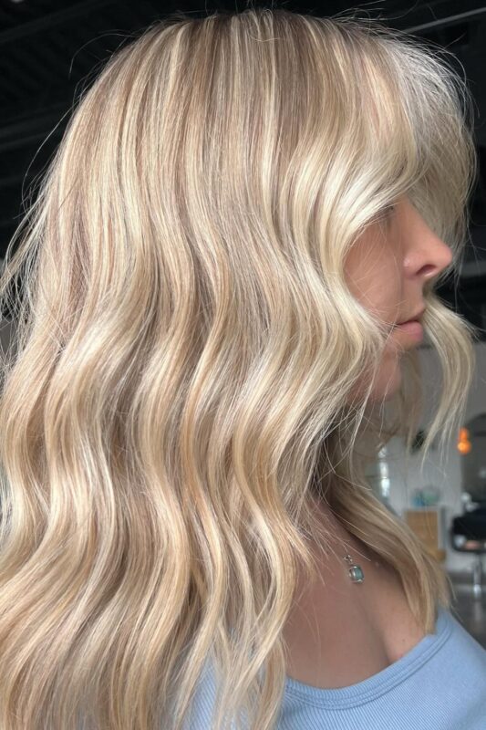 Woman with a butter blonde balayage.