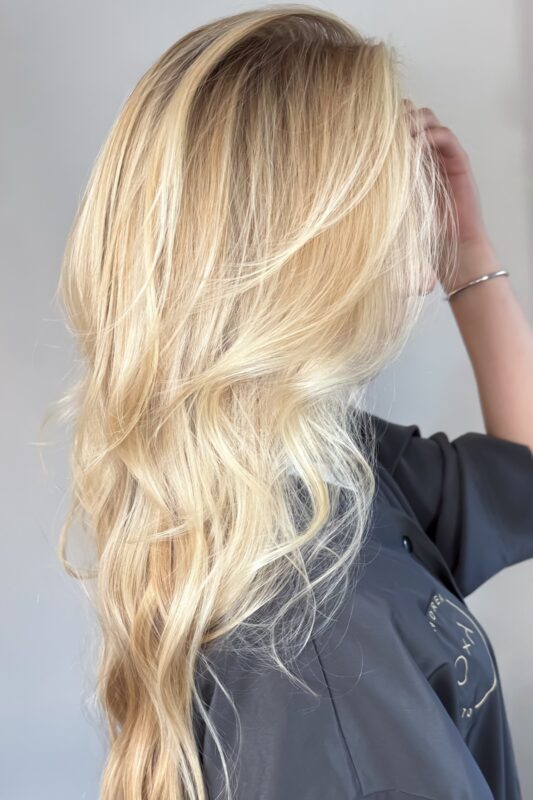 Woman with a butter blonde highlights.