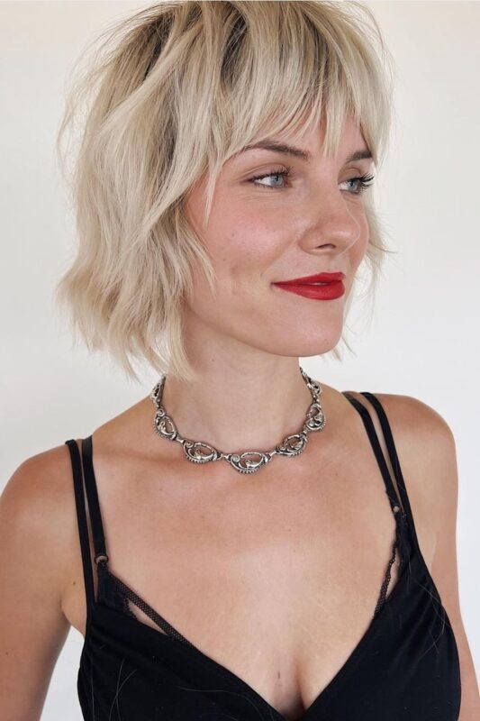 Woman with a chin-length choppy bob haircut.