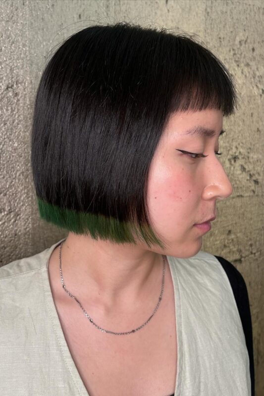 Woman with a chin-length dip-dyed blunt bob haircut.