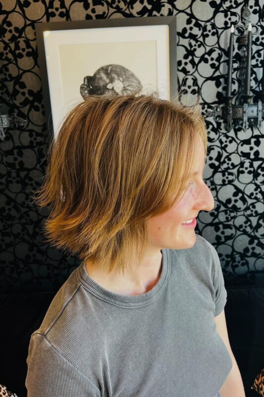 Woman with a chin-length flippy bob haircut.