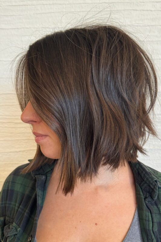 Woman with a chin-length textured A-line bob haircut.