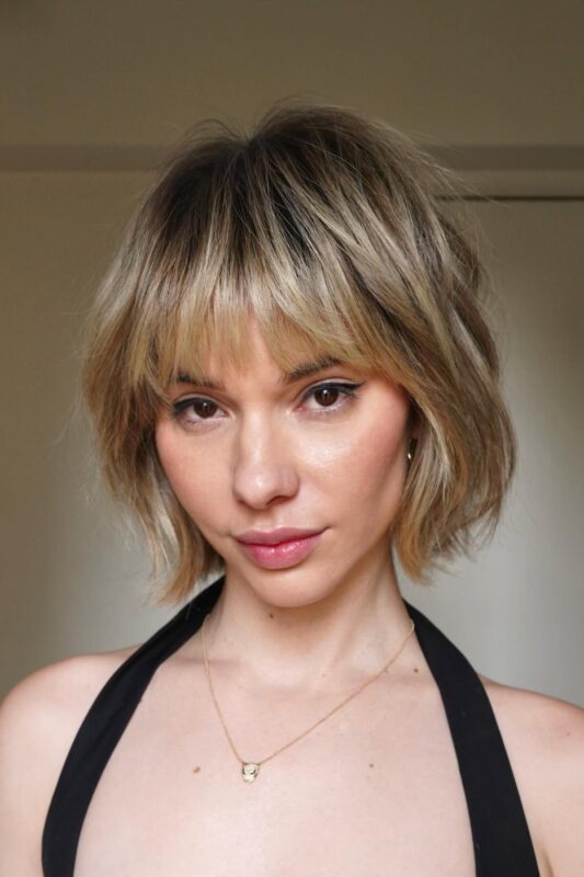 Woman with a choppy short bob perfect for fine hair.