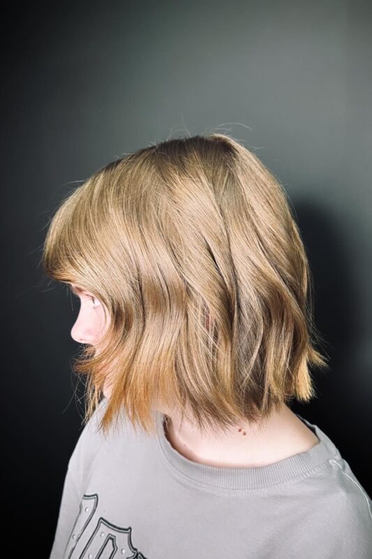 Woman with a chin-length bob haircut for fine hair.