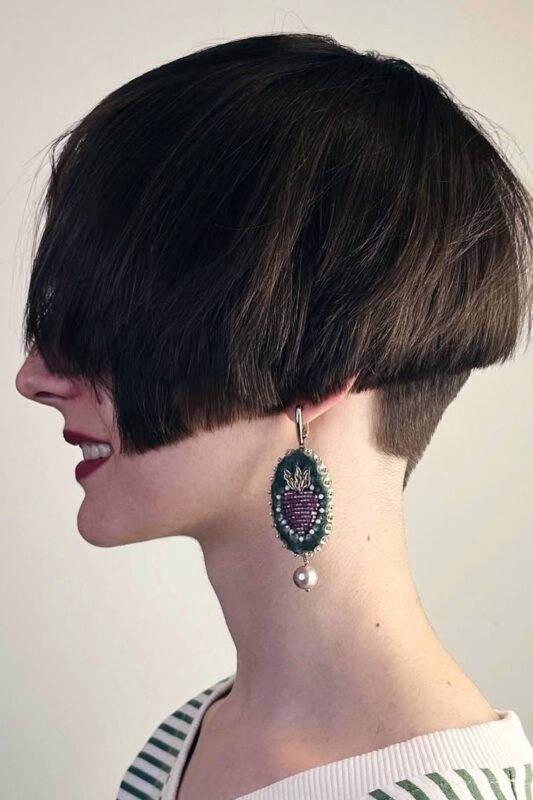 Woman with a French bob haircut and undercut.