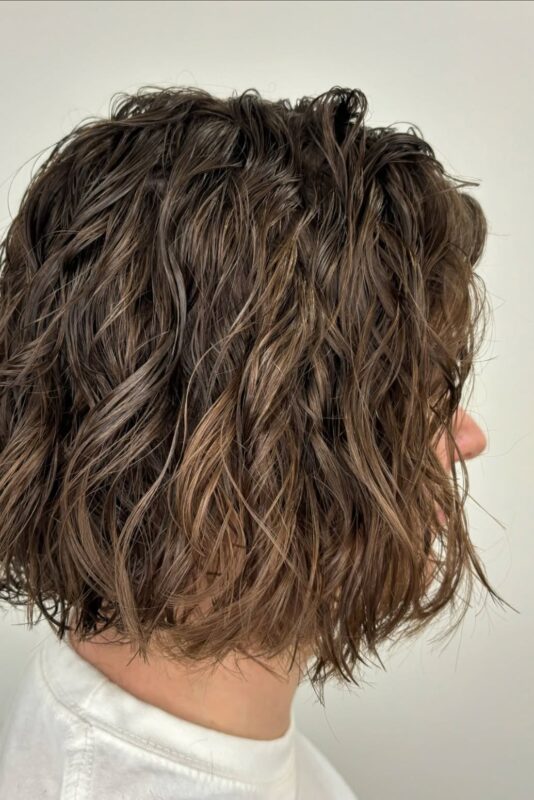 Woman with a layered bob haircut designed for thin hair.