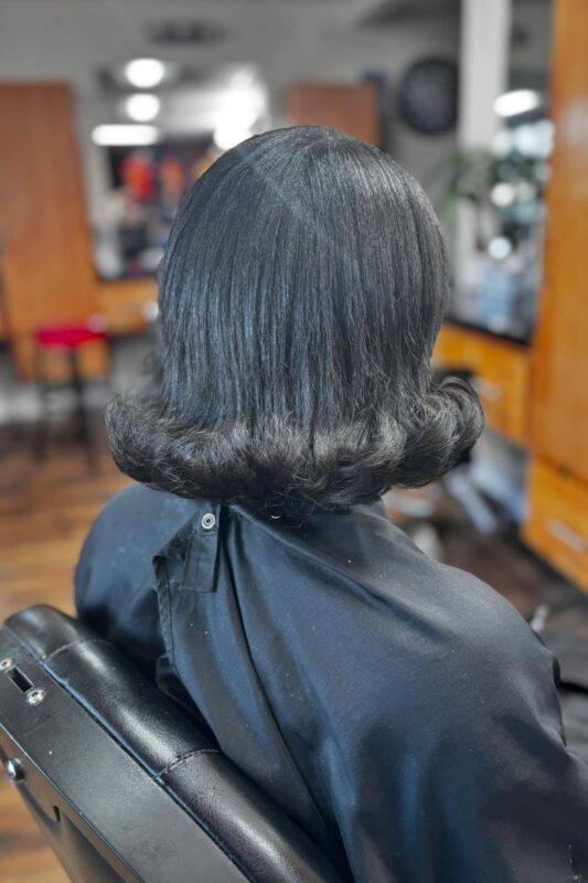 Woman with a medium-length haircut for fine, straight hair.