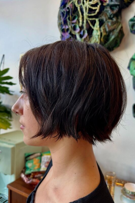 Woman with a razor-cut bob tailored for thin hair.