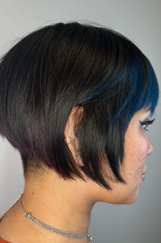 Woman with a short French bob haircut.