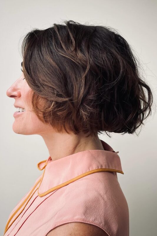 Woman with a textured French bob haircut.