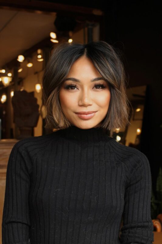 Woman with a textured, layered French bob.